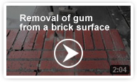 Removal of gum from a brick surface